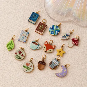 Detailed view of various nature-themed stainless steel charms for DIY jewelry making