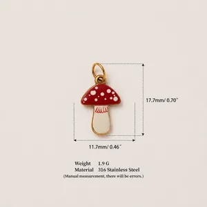 Detailed view of red enamel mushroom pendant in gold plated 316 stainless steel with size