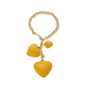 Golden chain keychain featuring three yellow heart pendants for bag charm accessories