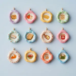 Close-up of colorful ceramic food pendants featuring assorted cute breakfast motifs