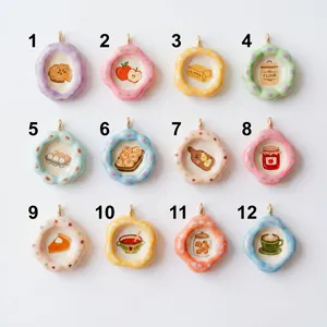 Collection of twelve colorful round pendants with various food motifs in a grid layout