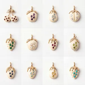 Une collection de douze pendentifs en forme de fruits avec divers accents de pierres fines
