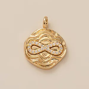 Elegant gold infinity symbol pendant with rippled texture and sparkling crystal inlay