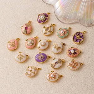 Collection of colorful enamel egg locket pendants featuring pearl and gold crystal details