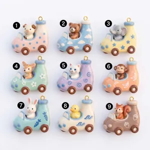Variety of cute ceramic cartoon animal car pendants with colorful patterns and gold loops