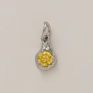 Teardrop-shaped silver-tone pendant with a brilliant round yellow stone for DIY jewelry