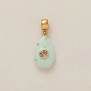 Elegant teardrop pendant with light green mottled enamel and crystal, copper gold-plated