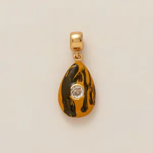 Teardrop charm with yellow marble enamel and crystal inset in 18K gold plating finish