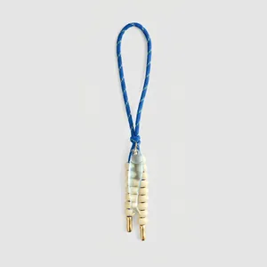 Artistic vintage bag charm with a blue braided cord loop and a transparent glass fish