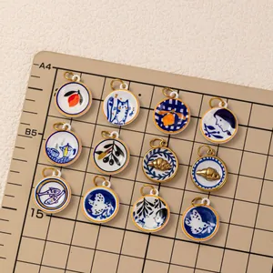 Detailed view of variety Mediterranean plate style DIY charms with 18K gold plated finish