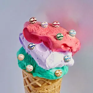 Creative macro of colorful enamel birthstone charms on a decorative ice cream cone