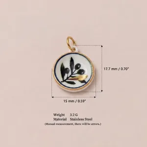Macro detail showing size and weight of 18K gold plated stainless steel pendant