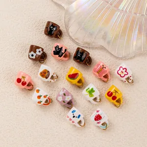 Detailed view of assorted cute printed miniature cup charms for jewelry making DIY projects