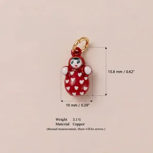 Macro view of red doll pendant charm showing dimensions 15.8mm by 10mm