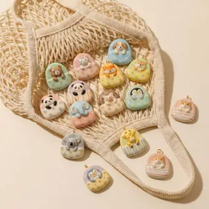 Collection of various cute cartoon animal charms in sleeping bag pockets for jewelry