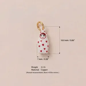 Macro detail of cute white doll charm with 16.8mm height and 7mm width dimensions.