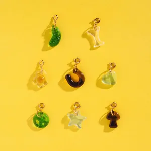 Detail view showing colorful resin charms in star, mushroom, and heart shapes for DIY jewelry