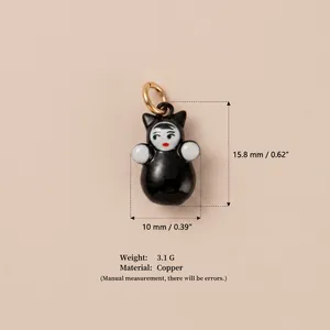 Detailed close-up view of a cute black doll pendant with size and weight specifications.