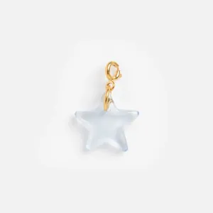 Detailed view of a light blue translucent resin star pendant with a gold lobster clasp.