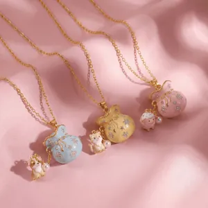 Detailed view of enamel lucky bag necklaces featuring cute animal charms and pearls.