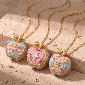 Exquisite pink and gold apple locket necklaces featuring ballet dancer and carousel motifs
