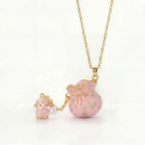 Detailed macro view of a pink enamel lucky bag necklace with a cute sheep and pearl
