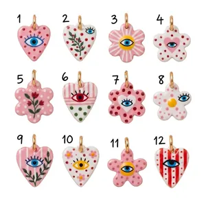 Selection of 12 colorful DIY heart and flower pendants with evil eye and floral patterns