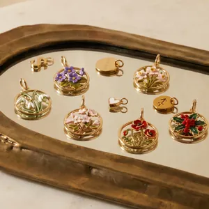 Detail of stainless steel birth flower pendants with colorful enamel on a mirror