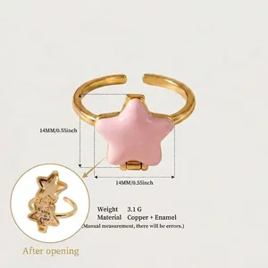 Detailed macro view of pink enamel star locket ring showing dimensions and material info