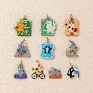 Collection of nine colorful cat charms depicting various sports for DIY jewelry