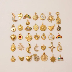 Assorted gold stainless steel charms featuring sun moon heart and star designs