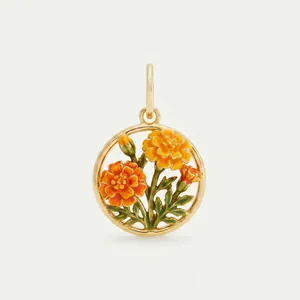 Detail of round gold-tone pendant featuring orange and yellow enamel marigold flowers