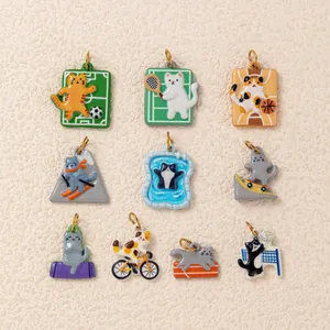 Detailed view of various cat sports charms including skiing, tennis, and cycling themed designs.