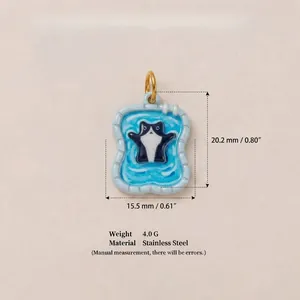 Detailed view of cat skiing pendant with size measurements and material specs