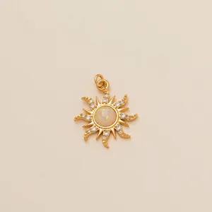 High-detail macro view of a gold sun pendant featuring a central opal stone inlay