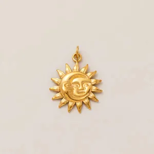 Close-up detail showing the intricate celestial sun and moon face pendant in a gold finish