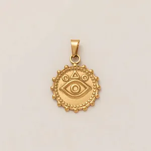 Detailed view of gold-plated stainless steel Evil Eye pendant with geometric symbols