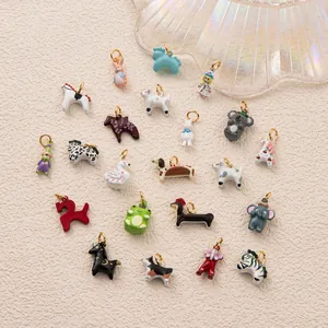 Detailed view of various colorful hand-painted animal charms for DIY jewelry making