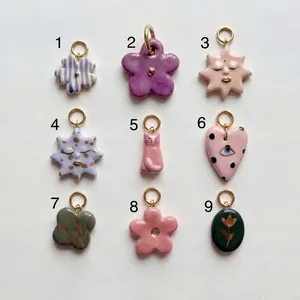 Assorted colorful DIY jewelry charms in flower heart and sun shapes for handmade accessories