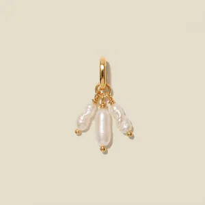Detailed view of a gold-plated charm with three elegant baroque freshwater pearls.