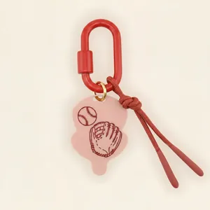 Sports themed keychain charm featuring a baseball and glove design on a pink tag