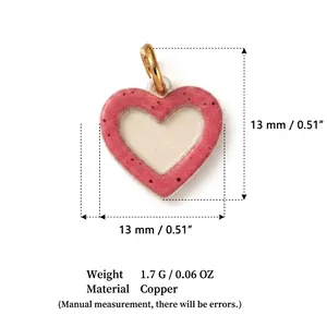 Detailed view of small red heart pendant with 13mm dimensions and copper material specs