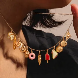 Detailed shot of 18K gold-plated stainless steel necklace with playful food charms.