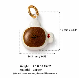 Close-up of coffee cup pendant showing dimensions, weight, and material specs.