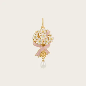 Detailed view of enamel flower bouquet pendant with pink ribbon and pearl drop