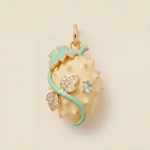 Vue détaillée d'un pendentif en résine en forme de fruit avec feuilles vertes et gemme bleue.