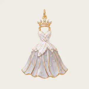 Detailed view of an elegant dress-shaped pendant with a golden crown and inlaid stones