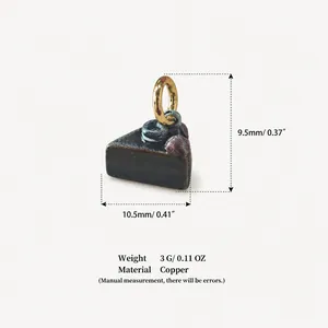 Detailed view of small copper cake pendant with 10.5mm width and 9.5mm height dimensions