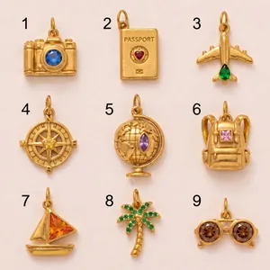 Detailed view of nine gold travel-themed titanium steel pendants with colorful gemstones.