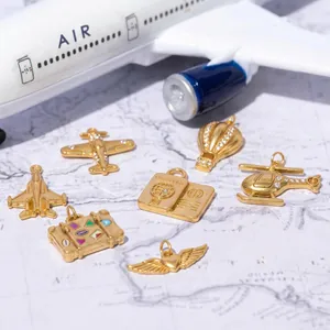 Set of 18K gold-plated stainless steel travel-themed charms displayed on world map background.